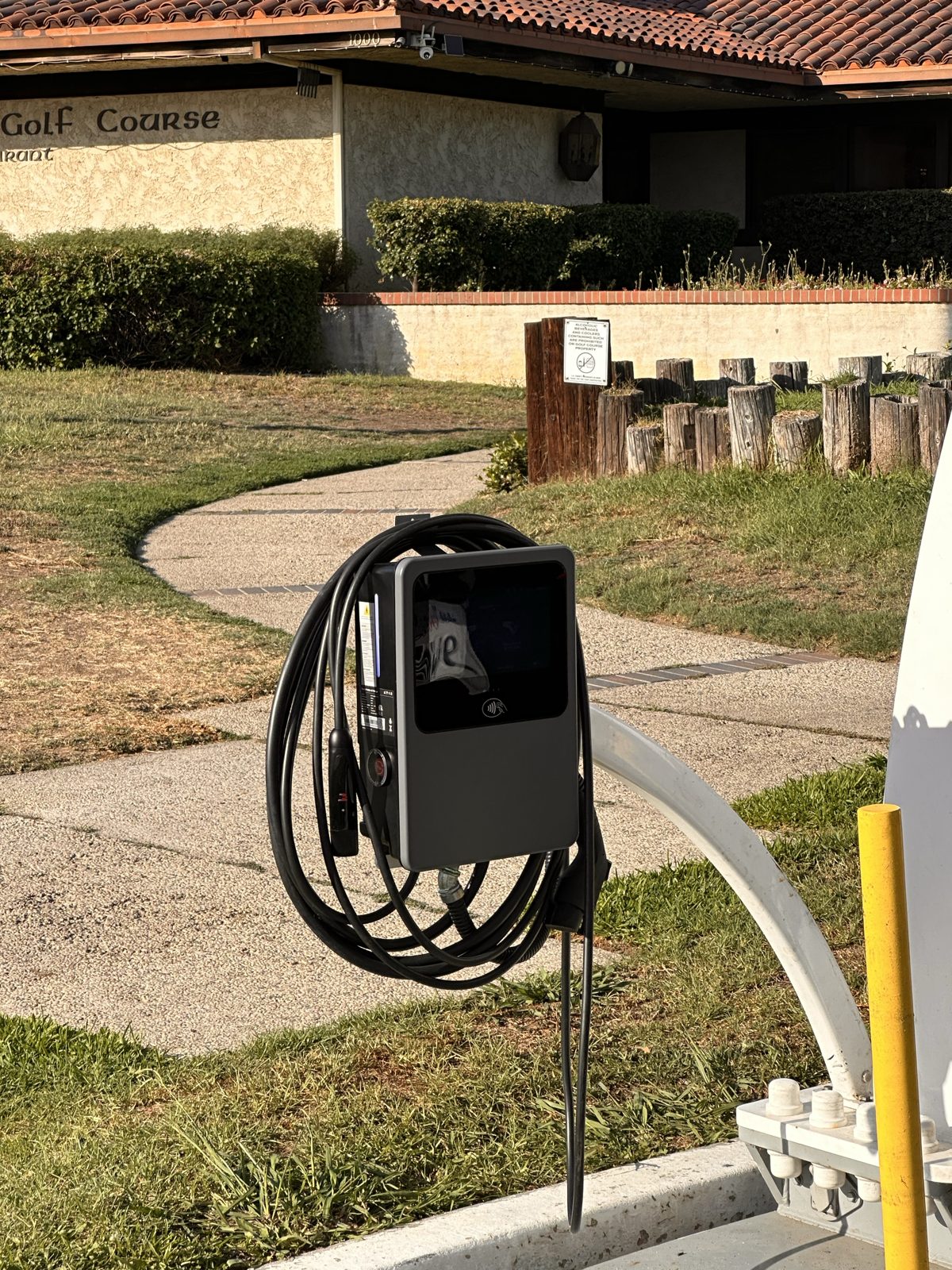 AC charger mounted at the golf course entrance
